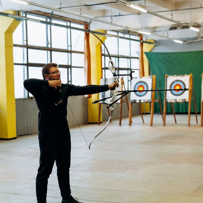Man in a controlled push-up position, focusing on form.