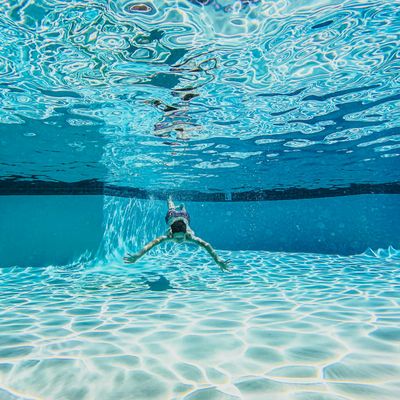 Side profile of a man breathing deeply before an exercise.